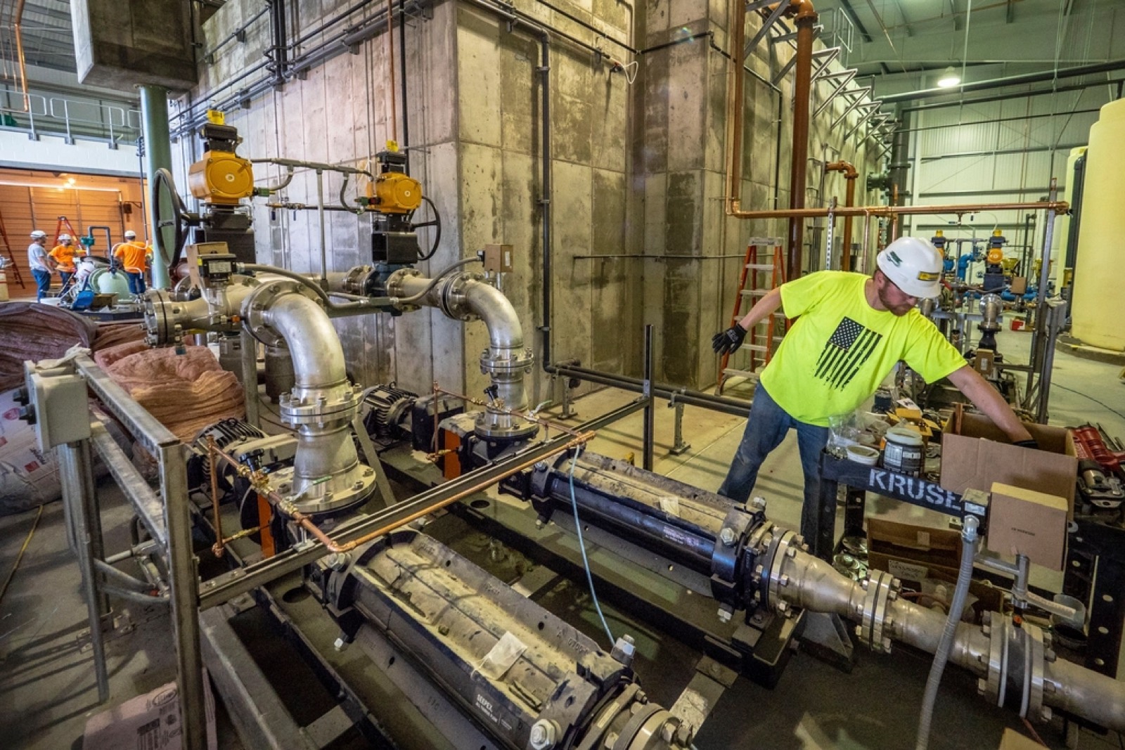 Pump sets and stainless pipework being installed at a pump station